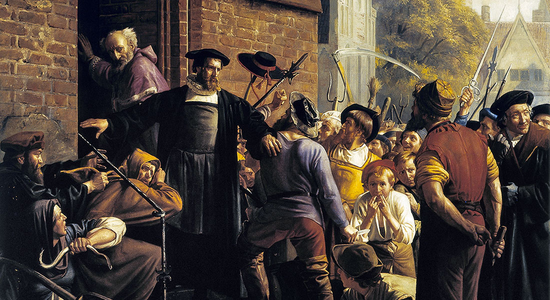 Artwork in the banquet hall in the main building on Frue Plads. Carl Bloch: The reformer Hans Tausen protects Zealand's bishop, Joachim Rønnow, from angry Copenhagen citizens 14 July 1533. Oil on plaster, 1876.